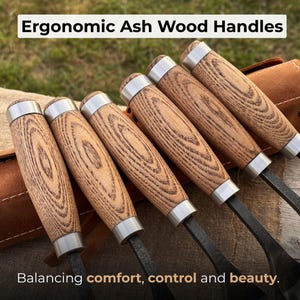 May include: A set of six tools with ergonomic ash wood handles. The handles are light brown with a wood grain pattern and are capped with silver metal. The text "Ergonomic Ash Wood Handles" and "Balancing comfort, control and beauty" are visible.