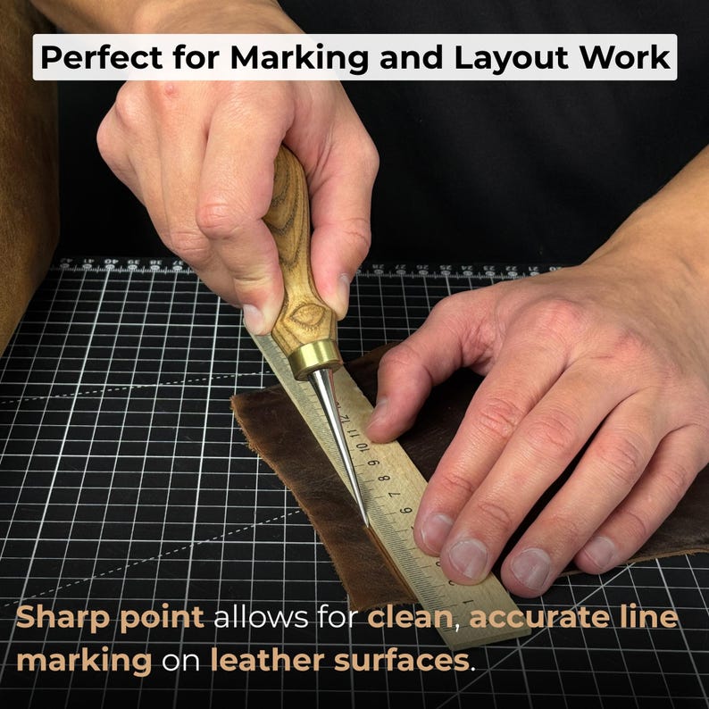 May include: A leather marking tool with a wooden handle and a sharp metal point is used with a ruler on a piece of brown leather. The text "Perfect for Marking and Layout Work" and "Sharp point allows for clean, accurate line marking on leather surfaces" are visible.