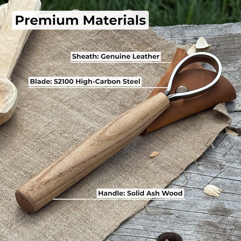 May include: A wood carving tool with a curved blade and a wooden handle. The blade is made of 52100 high-carbon steel, and the handle is solid ash wood. The tool is shown with a genuine leather sheath. The text "Premium Materials" is at the top.