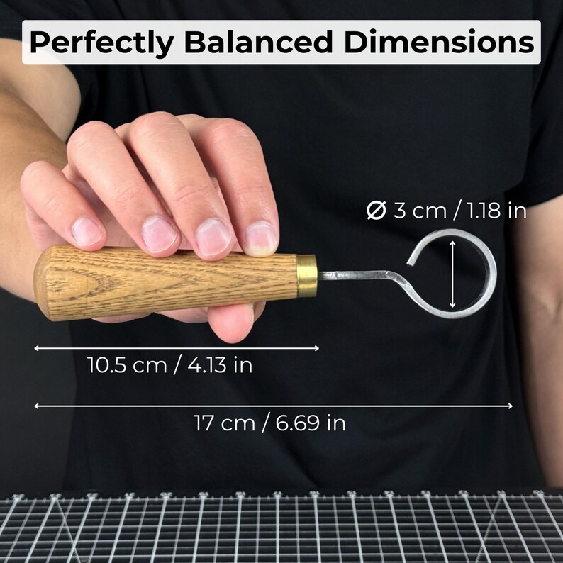 May include: A wooden-handled tool with a metal hook, held against a black background. The tool is 6.69 inches long, with a hook diameter of 1.18 inches. The text "Perfectly Balanced Dimensions" is at the top.