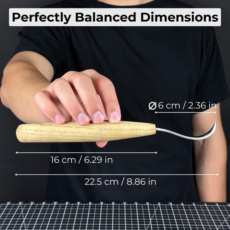 May include: A wood-handled carving knife with a curved blade, held in a person's hand. The text "Perfectly Balanced Dimensions" is at the top. The knife is 6.29 inches long, with a blade length of 8.86 inches. The handle is 2.36 inches in diameter.