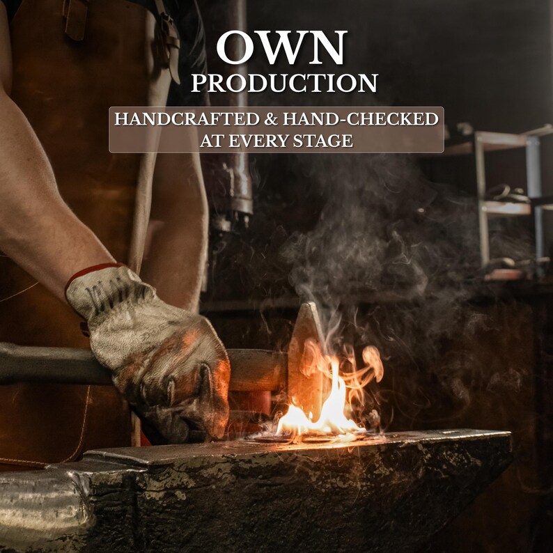 May include: A metal hammer strikes a glowing hot piece of metal on a dark anvil, producing sparks and flames. The text OWN PRODUCTION and HANDCRAFTED & HAND-CHECKED AT EVERY STAGE is overlaid in white and dark brown boxes against the workshop scene.
