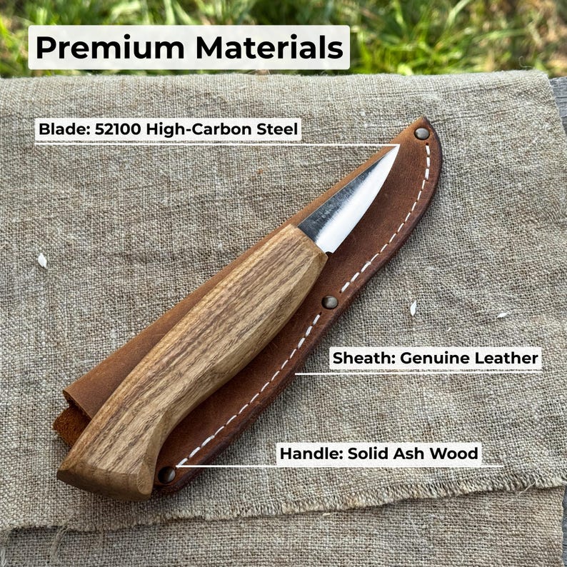 Wood carving knife on workbench with labeled materials, highlighting forged carbon steel blade, ash handle, and durable handmade build.