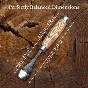 May include: A metal chisel with a light-colored wood handle featuring a dark grain pattern. The tool has a total length of 8.46 inches, a handle length of 4.13 inches, and a blade length of 3.54 inches. The text Perfectly Balanced Dimensions is visible.