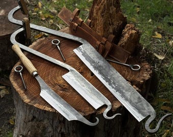 Stock Knives (Cloggers Knives). Sharp Blade is Protected by Leather Sheaths. Hand Forged from Hardened Carbon Steel, Ash Handle. Woodworking