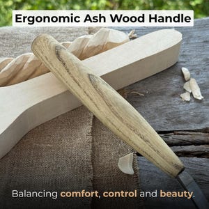 May include: Close-up of a wood carving tool with an ergonomic ash wood handle. The handle is light brown with a wood grain pattern. The text "Ergonomic Ash Wood Handle" is at the top, and "Balancing comfort, control and beauty" is at the bottom.