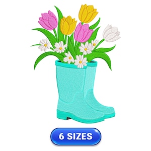 May include: A blue rubber rain boot filled with a bouquet of pink, yellow, and white tulips and daisies. The boot is sitting on a white background.