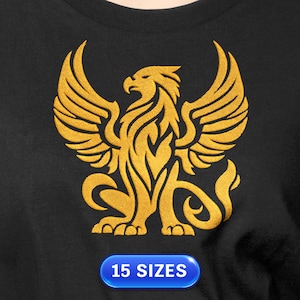 May include: A black t-shirt featuring a gold griffin design. The griffin is a mythical creature with the body of a lion and the head and wings of an eagle. The text "15 SIZES" is displayed on a blue oval at the bottom.
