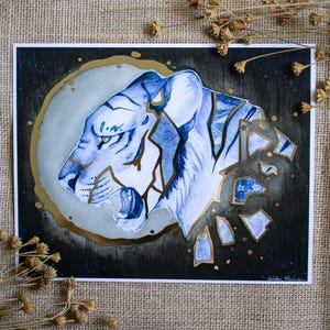 May include: A blue and gold watercolor painting of a tiger's head with a cracked and broken effect. The tiger's head is facing the left side of the image and is set against a dark blue background with gold accents.