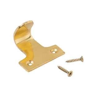 May include: A polished brass window sash lift with a curved handle and a rectangular base, accompanied by two screws. The lift features two holes for screw fixing. Window hardware.