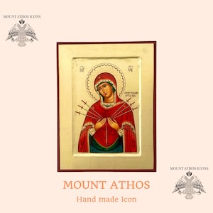 May include: A hand-painted icon of the Virgin Mary, also known as Our Lady of Sorrows, with seven swords piercing her heart. The icon is framed in gold and has a red background. The text "MOUNT ATHOS" is written below the icon.