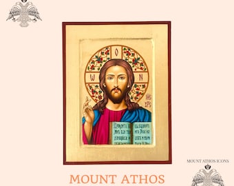 Puede incluir: Icono pintado a mano de Jesucristo en un panel de madera. El icono presenta un fondo dorado con una túnica roja y azul, y el texto "IHS XPS" en griego.