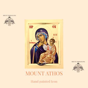 Può includere: Icona dipinta a mano della Vergine Maria e del bambino Gesù. L'icona è incorniciata in oro e ha uno sfondo dorato. La Vergine Maria indossa una veste blu e una corona rossa. Il bambino Gesù indossa una veste gialla. L'icona è etichettata "MP Θν IC XC N ΠΑΡΑΜΥΘΙΑ" e "MOUNT ATHOS".
