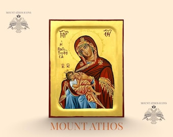 May include: Hand-painted icon featuring a religious figure in a red robe holding a child. The icon has gold accents and text in a stylized font. The words "MOUNT ATHOS" and "Hand painted Icon" are at the bottom.