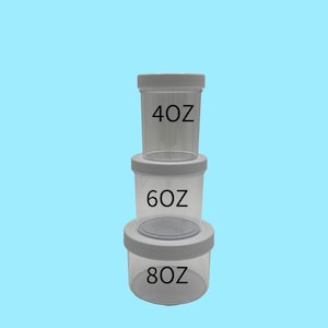 May include: Three clear plastic jars with white lids stacked on top of each other. The jars are labeled with the following measurements: 40 oz, 60 oz, and 80 oz. The background is a solid light blue.