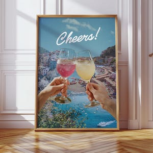 Plakat podróżniczy Cheers – sztuka ścienna z włoskiego wybrzeża, letni wydruk Aperol Spritz, dekoracja fotograficzna wybrzeża, wakacyjna atmosfera, dzieło sztuki w kuchennym barze