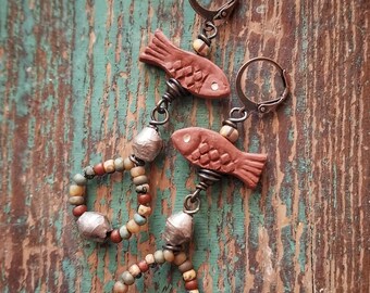 Beaded earrings, primitive fish, neutral colors