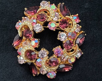 Sphinx Iridescent Aurora borealis vintage round pin or antique brooch with pink and purple crystals