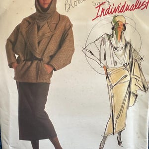 May include: A Vogue Patterns sewing pattern envelope for an Issey Miyake design, number 1599, size 8. The cover features a photograph of a person wearing a brown textured jacket and dark skirt, alongside a sketch of the same outfit with a blouse.