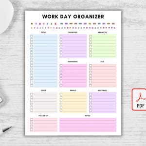 Op de afbeelding: Een witte Work Day Organizer planner met secties voor To Do, Prioriteiten, Projecten, Herinneringen, Vervaldatum, Oproepen, E-mails, Vergaderingen, Follow-up en Notities. De planner heeft een kleurrijk ontwerp en bevat een PDF-pictogram.