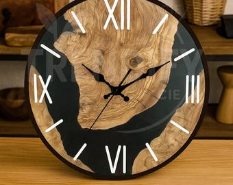 May include: A round wooden wall clock with a dark brown frame. The clock face features a natural wood grain design with black resin accents and white Roman numerals. The clock hands are black.