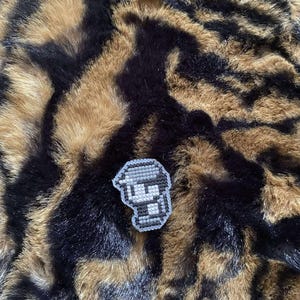 Hand stitched retro style Ash magnet