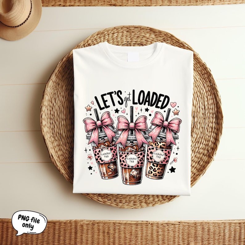 May include: White t-shirt with the text "Let's get loaded" and three cartoon images of iced coffee drinks with pink bows and leopard print designs.