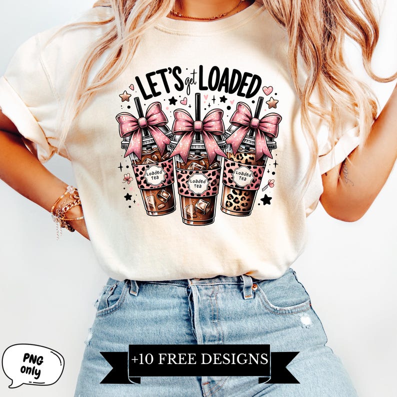 May include: White t-shirt with the text "Let's get loaded" and a graphic of three iced coffee drinks with pink bows and leopard print.