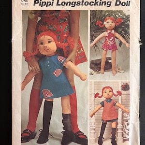 May include: Simplicity sewing pattern number 6063 for a Pippi Longstocking doll. The pattern includes instructions for making three different outfits for the doll, including a red and white dress, a blue and white dress, and a red and white pinafore dress. The pattern is for one size doll.