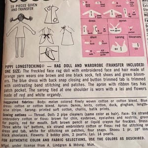 May include: A sewing pattern for a rag doll and wardrobe. The pattern includes 19 pieces and a transfer sheet. The doll is wearing a blue dress, a brown apron, a sarong, and a lei. The pattern is titled "Pippi Longstocking Rag Doll and Wardrobe (Transfer Included)".
