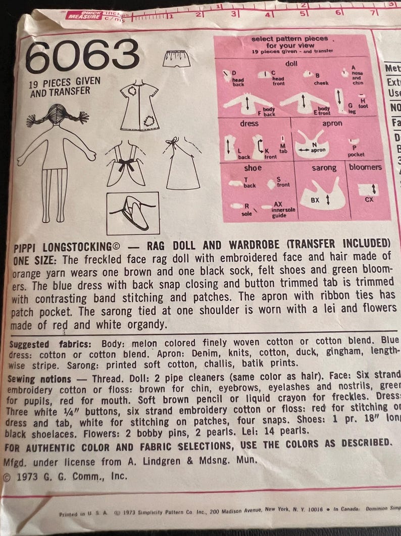 May include: A sewing pattern for a rag doll and wardrobe. The pattern includes 19 pieces and a transfer sheet. The doll is wearing a blue dress, a brown apron, a sarong, and a lei. The pattern is titled "Pippi Longstocking Rag Doll and Wardrobe (Transfer Included)".