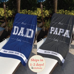 May include: Two personalized beach towels. One is blue with "Best DAD Ever" in white block letters, and the names Noah, Jeremy, Alice, and Riley. The other is black with "Best PAPA Ever" and the names Melissa and Georgie.