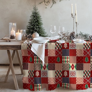 May include: A festive Christmas table setting with a red, green, and cream patchwork tablecloth. The table is set with white plates, glasses, candles, and a small Christmas tree. Pinecones and decorative greenery complete the holiday scene.