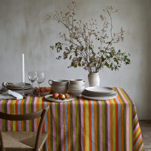 Colorful tablecloth perfect for spring and summer dining decor. The vertical stripes elongate the table visually. A fresh choice for seasonal gatherings.
