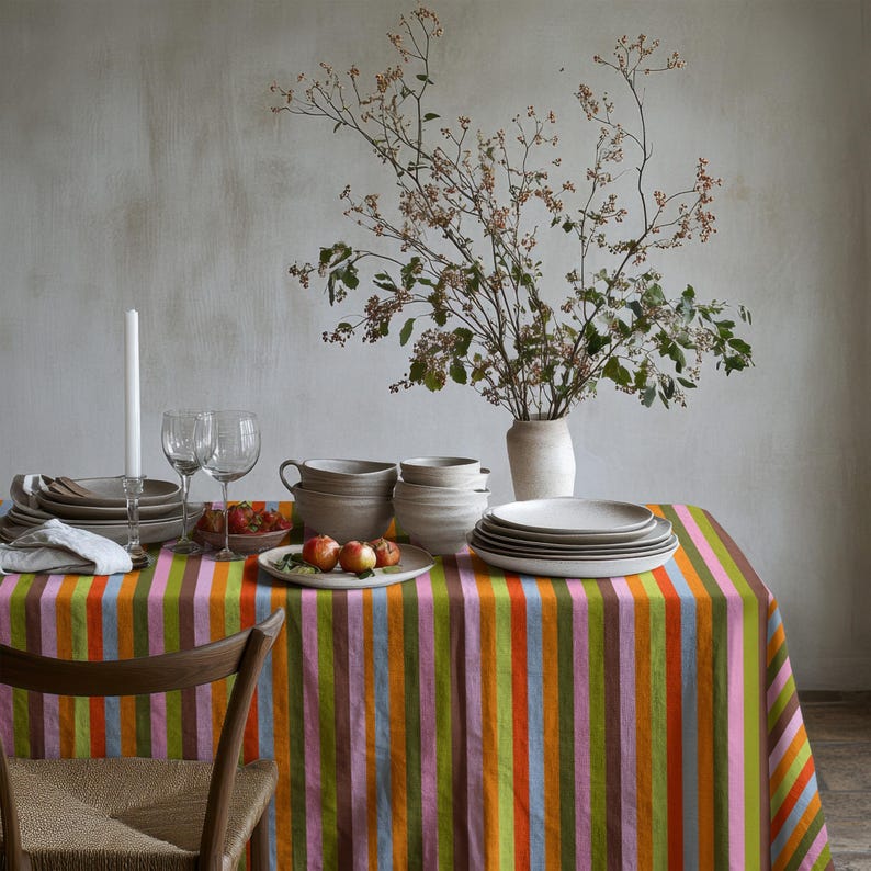 Colorful tablecloth perfect for spring and summer dining decor. The vertical stripes elongate the table visually. A fresh choice for seasonal gatherings.