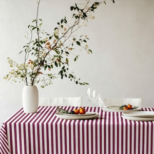 A vintage-inspired striped tablecloth that elevates both casual and special gatherings.
The rich burgundy tone pairs beautifully with neutral tableware.