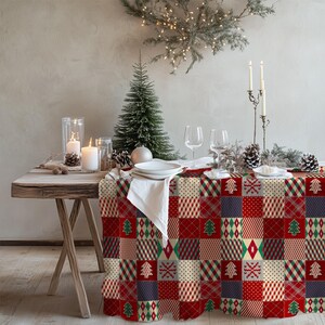 Cozy patchwork tablecloth with Christmas tree prints, creating a nostalgic and inviting dining space.