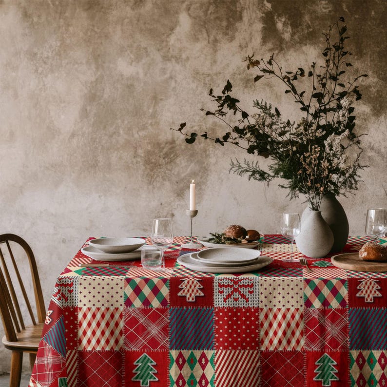 Patchwork Christmas tablecloth with tree and snowflake motifs, perfect for rustic cottage-style winter decor.