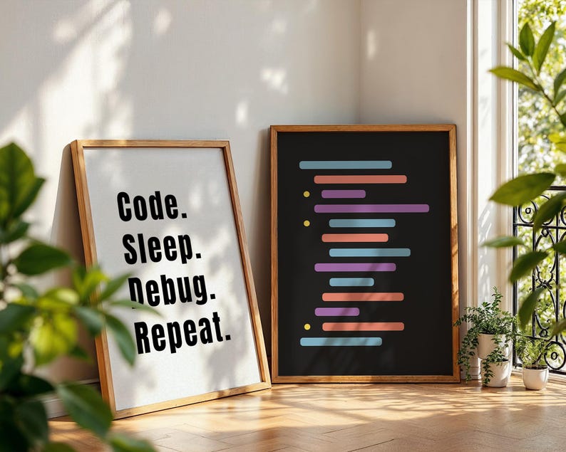 Peut inclure: Deux impressions encadr&eacute;es avec un fond noir et du texte blanc. L'impression de gauche dit "Code. Sleep. Debug. Repeat." L'impression de droite a une s&eacute;rie de lignes color&eacute;es qui ressemblent &agrave; du code.