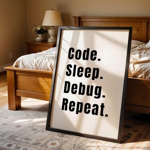 Peut inclure: Une affiche encadr&eacute;e noire avec un fond blanc et du texte noir qui dit "Code. Sleep. Debug. Repeat."