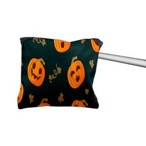 May include: A black putter cover with a repeating pattern of orange jack-o'-lanterns and gold leaves. The cover is attached to a silver golf club. The cover has a black trim.