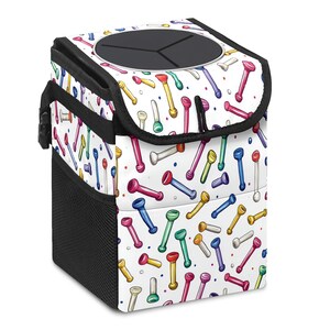 May include: A car trash can with a white background and a colorful pattern of abstract shapes. The trash can has a black lid with a circular opening and a black mesh side pocket. The pattern includes red, blue, yellow, and green shapes.