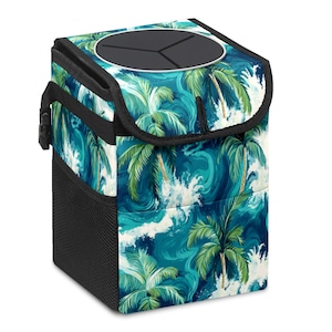 May include: A square, insulated car trash can with a tropical palm tree and ocean wave design. The trash can has a black mesh side pocket, a black lid with a circular opening, and a black handle. The exterior features a vibrant teal and white color scheme.
