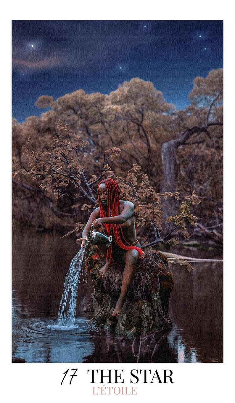 May include: A tarot card titled 17 THE STAR L'&Eacute;TOILE featuring a person with long red hair sitting on a tree stump in a dark pond, pouring water from a metallic pitcher into the water below under a night sky with visible stars and trees.