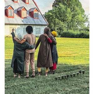 May include: A tarot card titled 10 OF CUPS DE COUPE featuring four people standing in a green field with arms around each other, facing a large building under a rainbow. Ten metallic cups are arranged in an arc on the grass in the foreground.