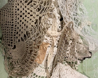 Lace, Fabric & Trims - A Variety of lace and trims, as well as vintage pieces of linens, and doilies.