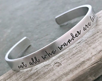 not all who wander are lost, Hand stamped aluminum bracelet, 1/4 Inch Bangle Silver tone Cuff Bracelet, Lightweight, Traveler - wanderer