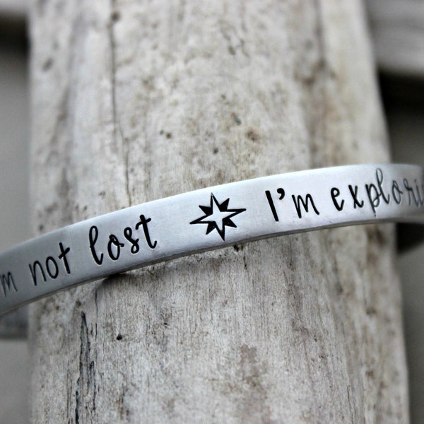 I'm not lost I'm exploring - Hand stamped aluminum bracelet - 1/4 Inch Bangle Silver tone Cuff Bracelet - Compass - Traveler - wanderer