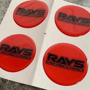 Excellent Quality/ Set x 4 Self Adhesive Silicone Stickers Logo Rays for Wheel center hub caps / Rims Tuning / Car rims accessories