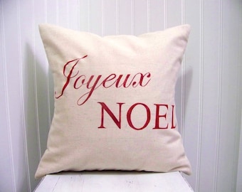 May include: A white pillow with the words "Joyeux Noel" in red lettering.